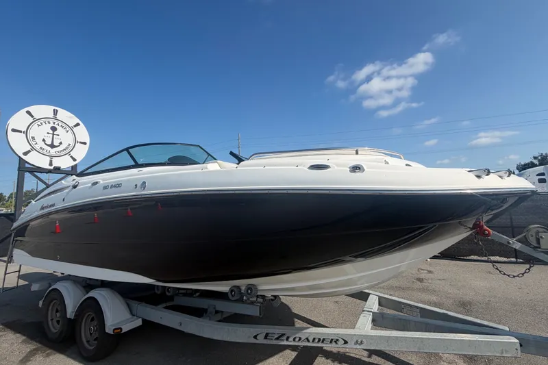 The Image of 2019 Hurricane SunDeck 2400 OB on a trailer, ready for adventure. - 0