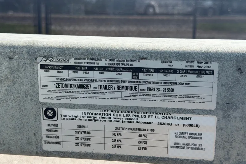 Slide: The Image of Label on EZ Loader trailer, model T96RT 23-25 5800, manufactured November 2018. - 80