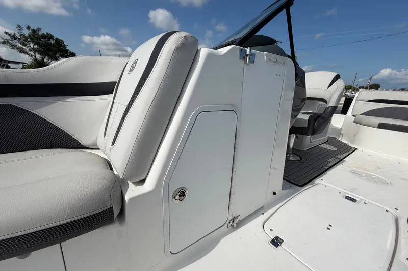 Slide: The Image of 2019 Hurricane SunDeck 2400 OB interior with seating and storage compartment. - 56