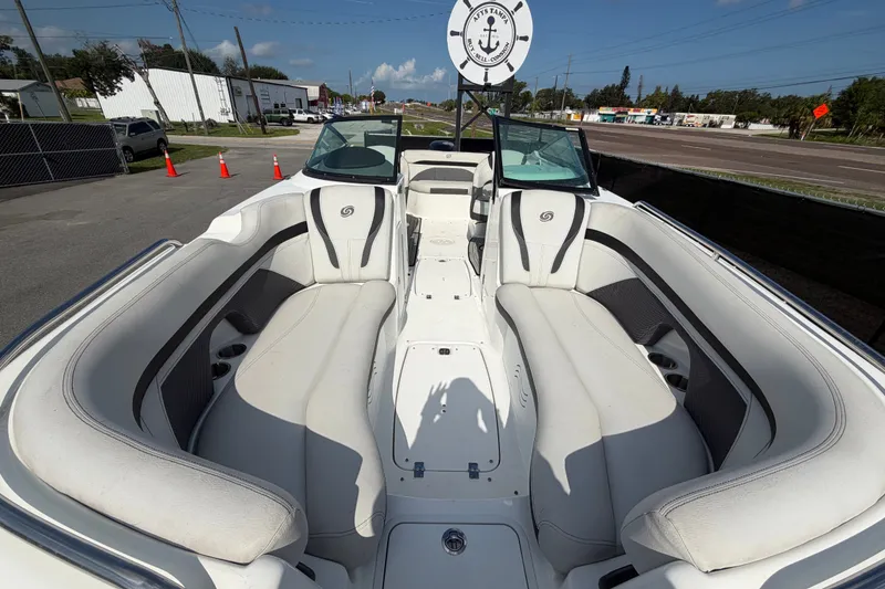 Slide: The Image of 2019 Hurricane SunDeck 2400 OB boat with spacious seating and sleek design. - 53