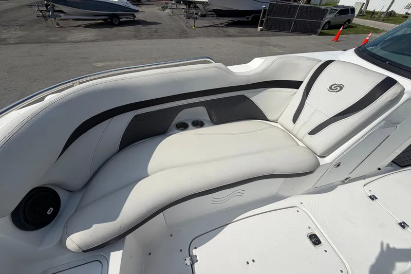 Slide: The Image of 2019 Hurricane SunDeck 2400 OB boat interior with white seating and black accents. - 51