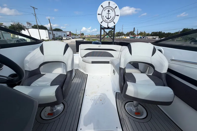 Slide: The Image of 2019 Hurricane SunDeck 2400 OB boat interior with two swivel seats and a rear bench. - 60