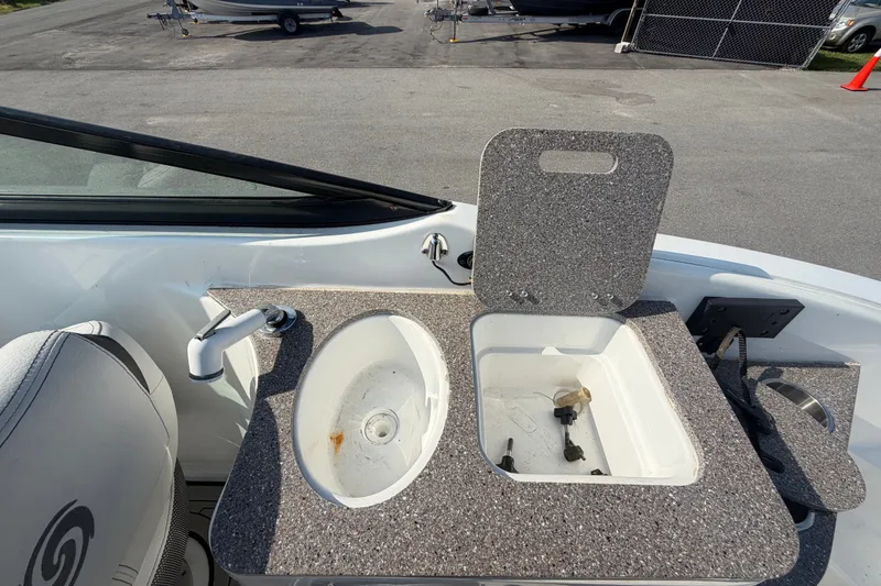 Slide: The Image of 2019 Hurricane SunDeck 2400 OB boat sink and countertop detail. - 18