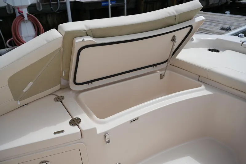 Slide: The Image of 2021 Grady-White 251 Coastal Explorer boat with open storage compartment. - 30