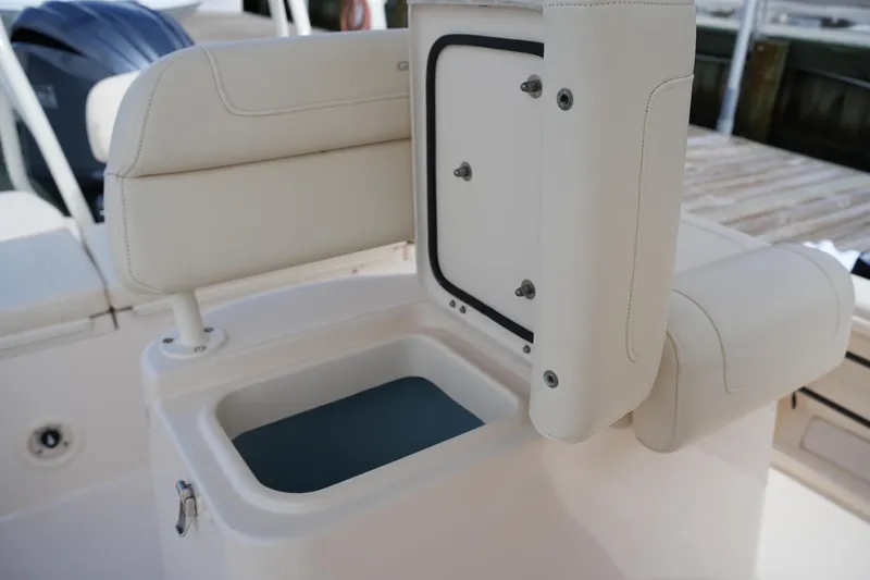 Slide: The Image of 2021 Grady-White 251 Coastal Explorer boat seat with storage compartment open. - 17