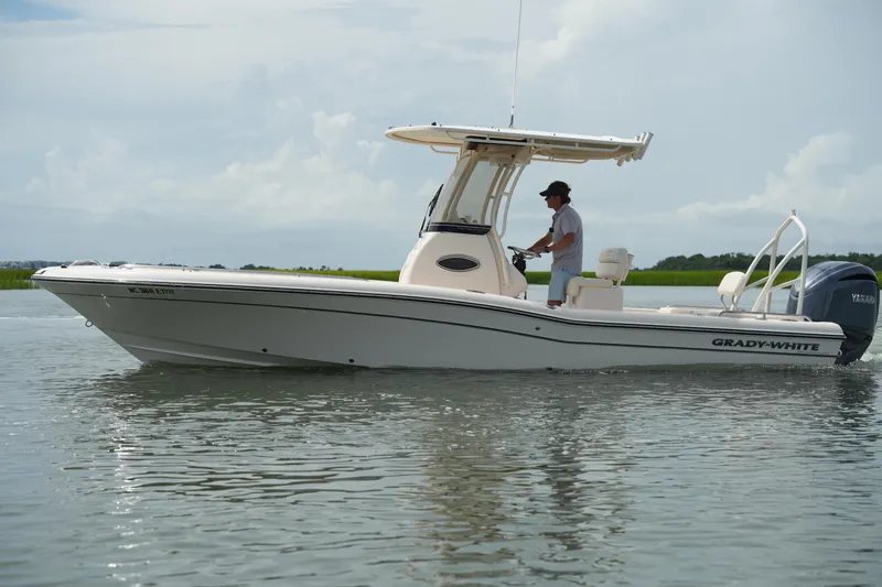 The Image of 2021 Grady-White 251 Coastal Explorer boat cruising on calm water. - 0