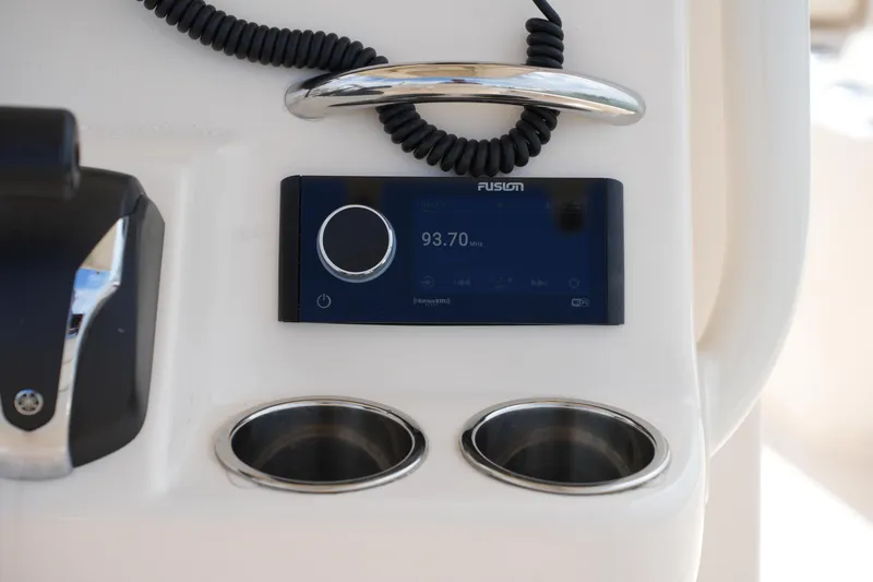 Slide: The Image of 2021 Grady-White 251 Coastal Explorer dashboard with Fusion stereo and cup holders. - 24