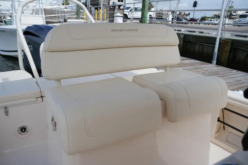 Slide: The Image of 2021 Grady-White 251 Coastal Explorer boat seating, featuring luxurious beige upholstery. - 16