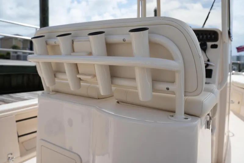 Slide: The Image of 2021 Grady-White 251 Coastal Explorer boat with rod holders and cushioned seating. - 15