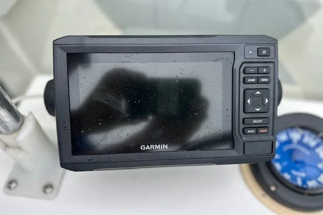 Slide: The Image of Garmin GPS device on 1975 F L Tripp & Sons 18 Center Console boat dashboard. - 7