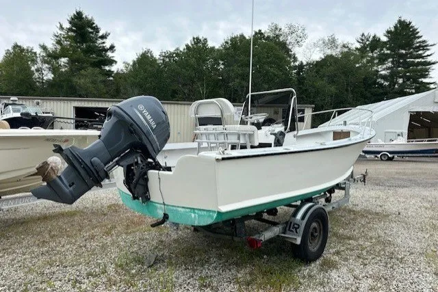 Slide: The Image of 1975 F L Tripp & Sons 18 Center Console boat on trailer, with Yamaha outboard motor. - 3