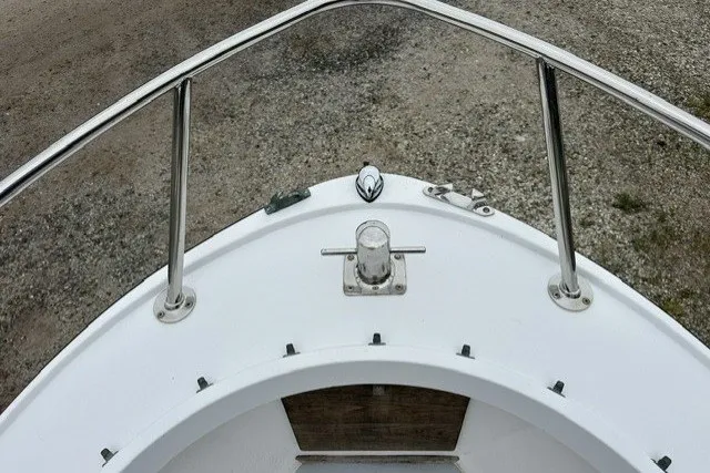 Slide: The Image of 1975 F L Tripp & Sons 18 Center Console boat bow with stainless steel railings. - 15