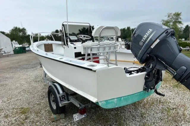 Slide: The Image of 1975 F L Tripp & Sons 18 Center Console boat with Yamaha outboard motor on trailer. - 4