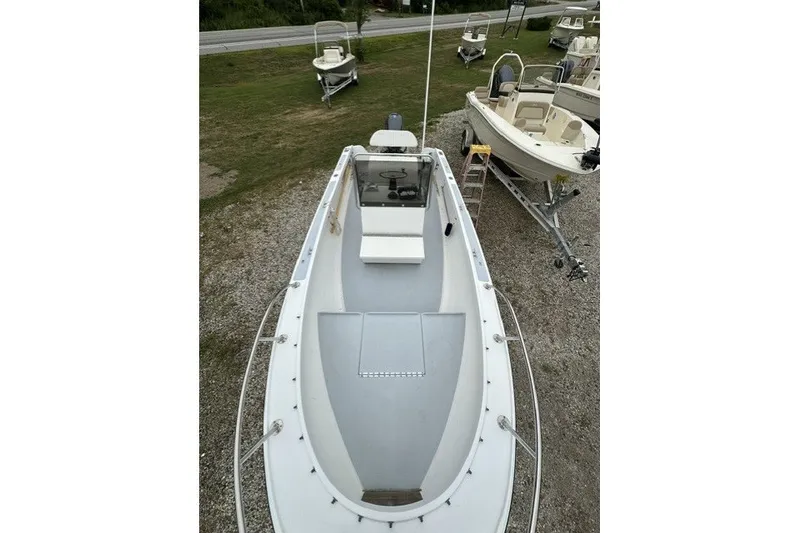 Slide: The Image of 1975 F L Tripp & Sons 18 Center Console boat on display outdoors. - 16