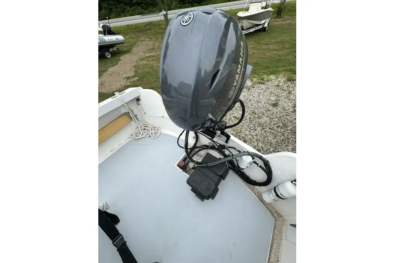 Slide: The Image of 1975 F L Tripp & Sons 18 Center Console boat with Yamaha outboard motor. - 18