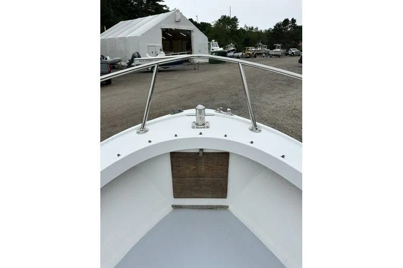 Slide: The Image of 1975 F L Tripp & Sons 18 Center Console boat at a marina. - 14