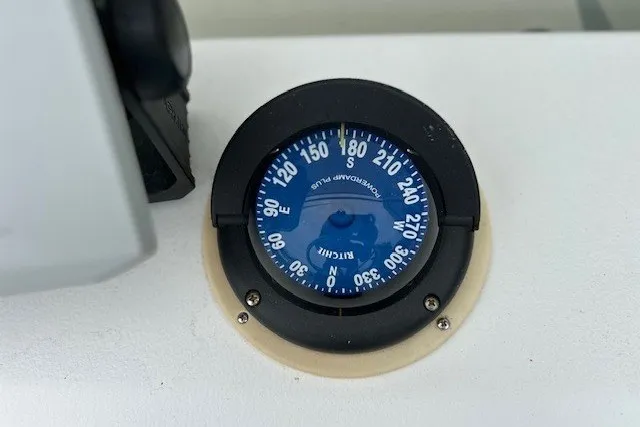Slide: The Image of Compass on 1975 F L Tripp & Sons 18 Center Console boat dashboard. - 8