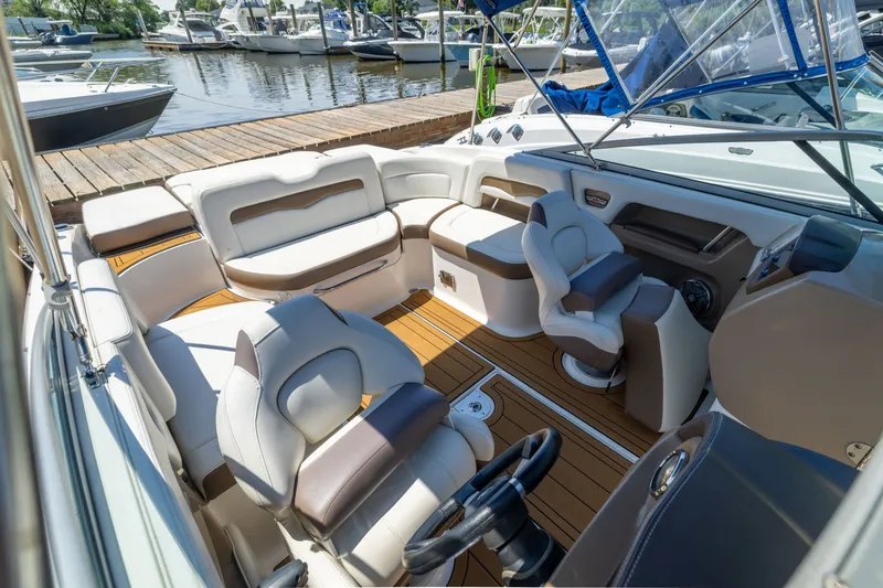 Slide: The Image of 2015 Chaparral 246 SSi boat interior with luxurious seating and modern dashboard. - 26