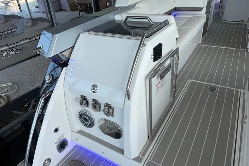 Slide: The Image of 2021 Formula 430 Super Sport Crossover boat interior with sleek seating and modern controls. - 68