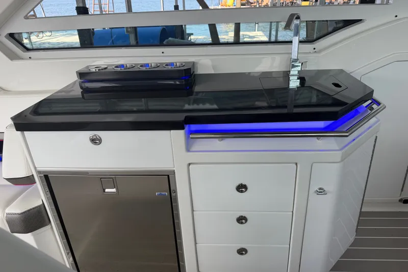 Slide: The Image of Luxury yacht kitchenette with sleek design, featuring a sink and storage, Formula 430 Super Sport Crossover 2021. - 62