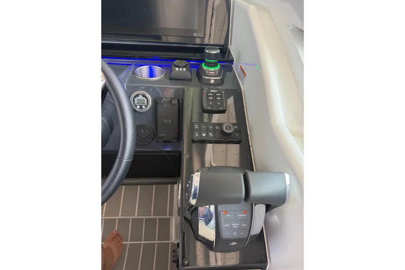 Slide: The Image of Control panel of a 2021 Formula 430 Super Sport Crossover boat, featuring advanced navigation controls. - 38