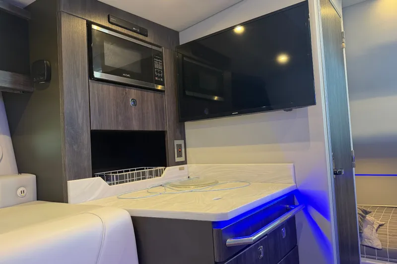 Slide: The Image of Interior of 2021 Formula 430 Super Sport Crossover with modern kitchen and entertainment setup. - 47