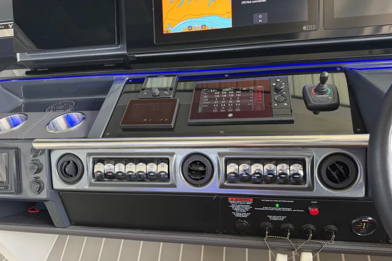 Slide: The Image of Control panel of a 2021 Formula 430 Super Sport Crossover boat with advanced navigation displays. - 39