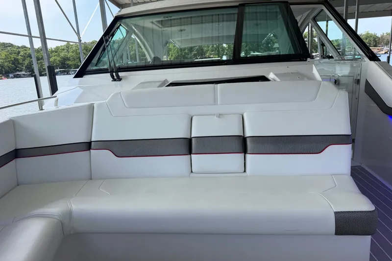 Slide: The Image of 2021 Formula 430 Super Sport Crossover boat interior with white seating and modern design. - 55