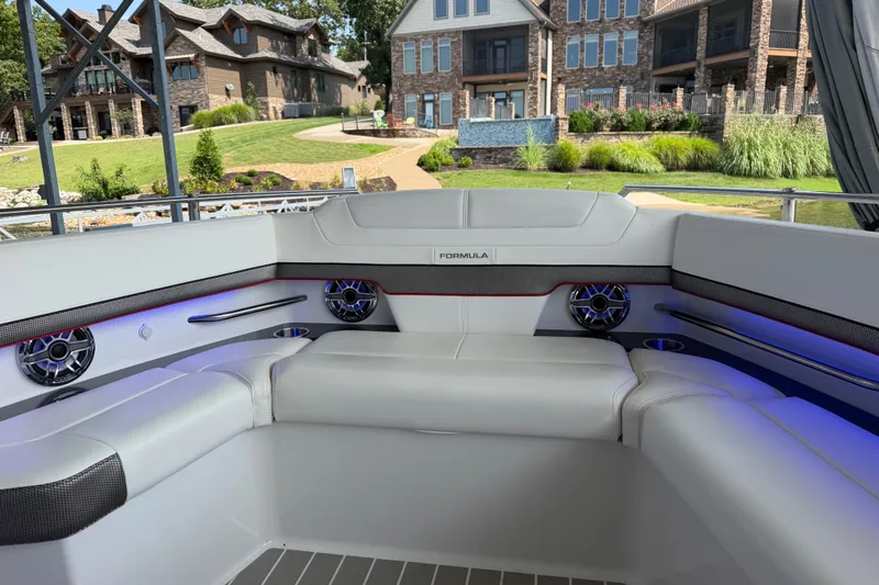 Slide: The Image of Luxury seating on 2021 Formula 430 Super Sport Crossover boat, with scenic waterfront view. - 53