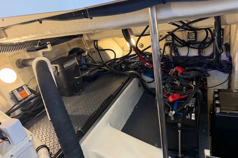 Slide: The Image of Engine compartment of 2021 Formula 430 Super Sport Crossover with wiring and battery setup. - 33