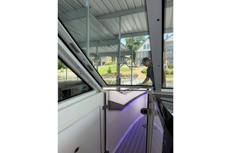 Slide: The Image of 2021 Formula 430 Super Sport Crossover interior view with dock and houses in background. - 59