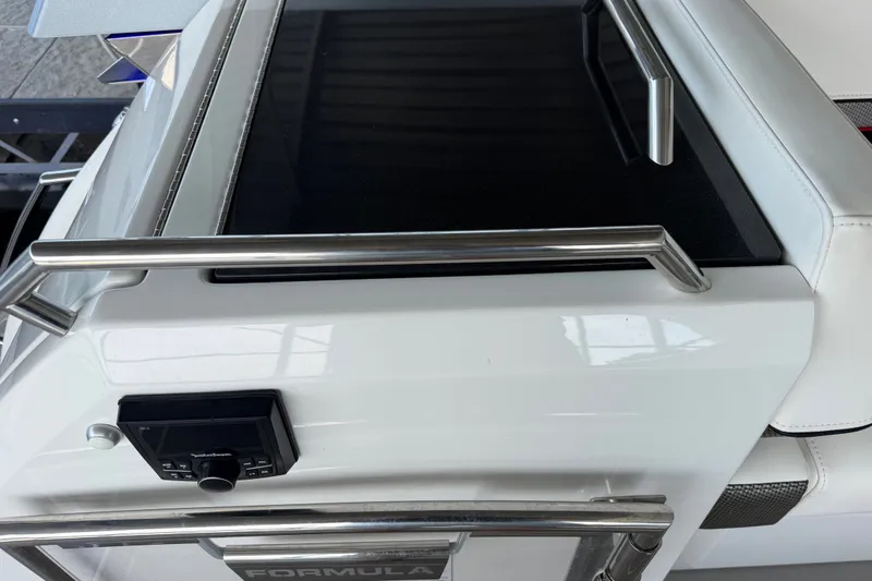 Slide: The Image of 2021 Formula 430 Super Sport Crossover boat interior with sleek design and control panel. - 66