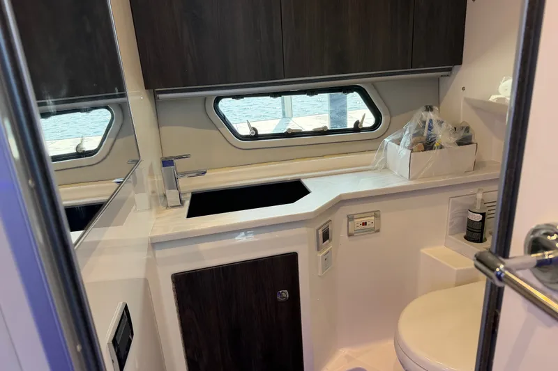 Slide: The Image of Interior of 2021 Formula 430 Super Sport Crossover yacht bathroom with sink and window. - 44
