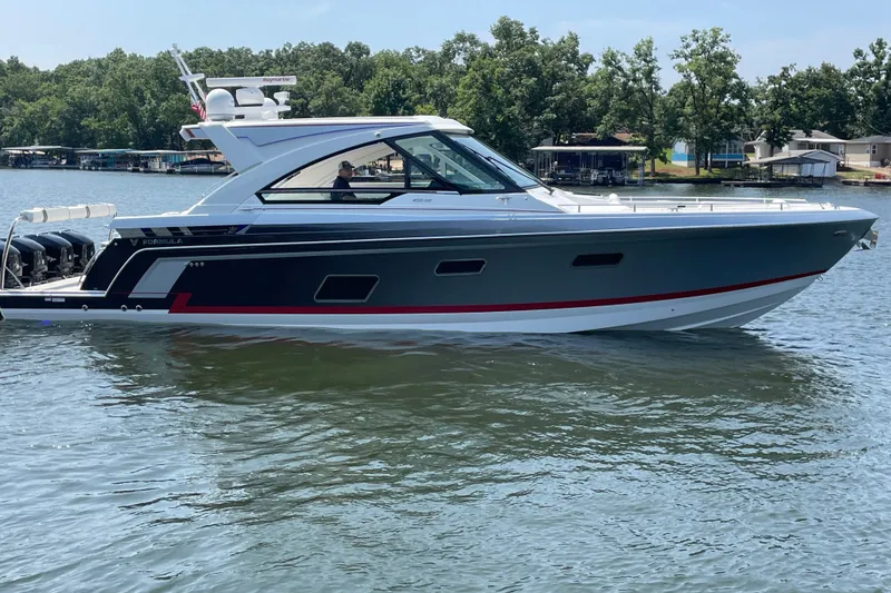 The Image of 2021 Formula 430 Super Sport Crossover yacht on a serene lake. - 1