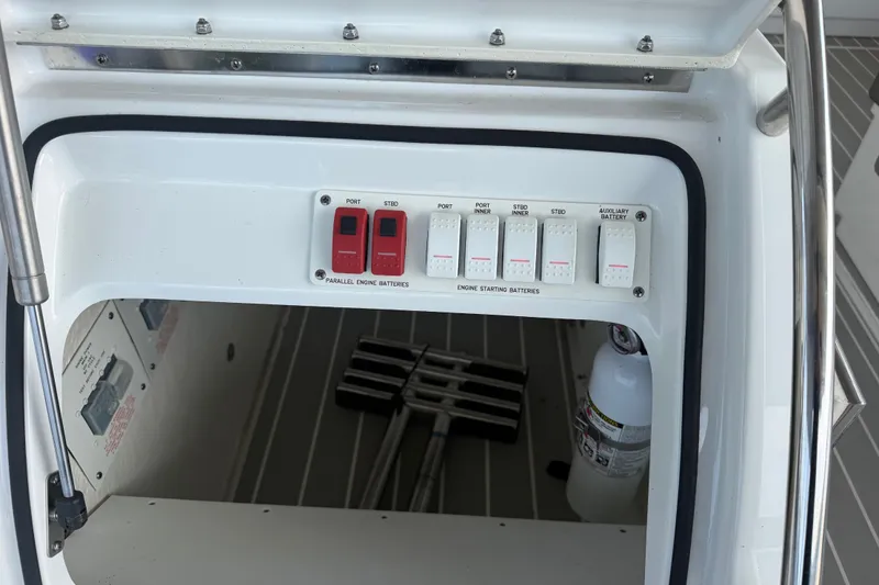 Slide: The Image of Control panel of a 2021 Formula 430 Super Sport Crossover boat, featuring battery switches. - 67