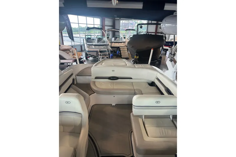 Slide: The Image of 2020 Cobalt CS23 Surf boat interior with luxurious seating in showroom. - 17
