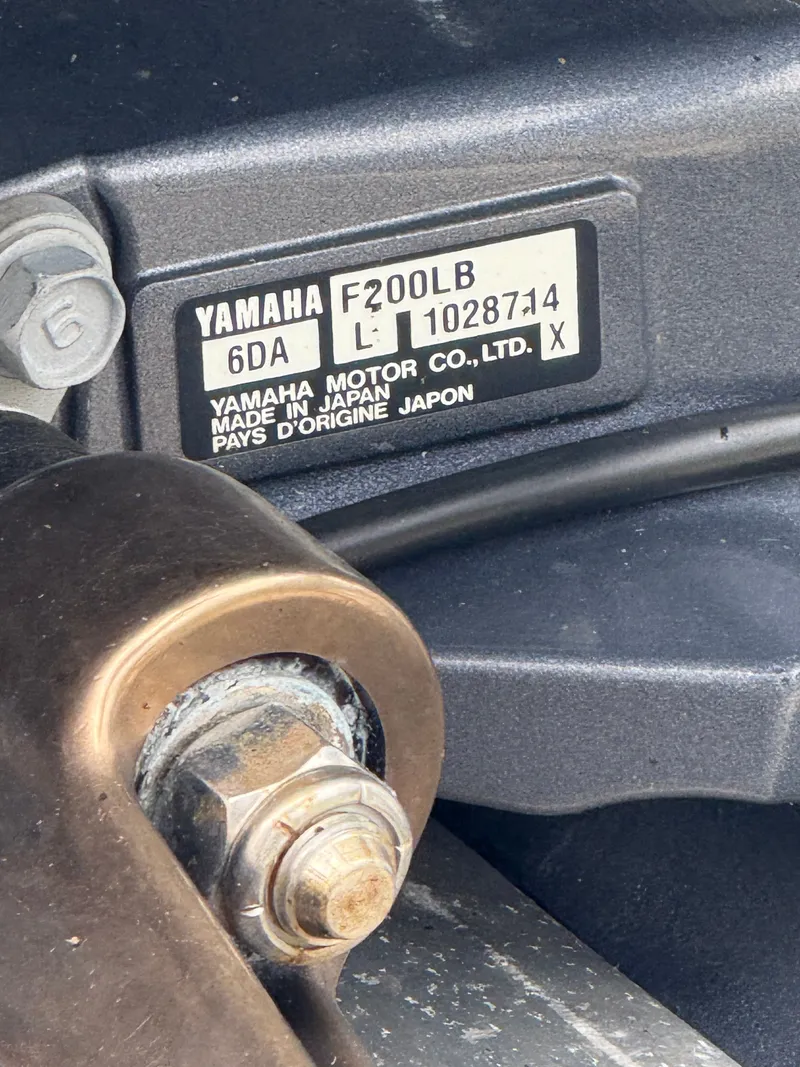 Slide: The Image of Close-up of a Yamaha F200LB outboard motor with serial number and manufacturing details. - 15