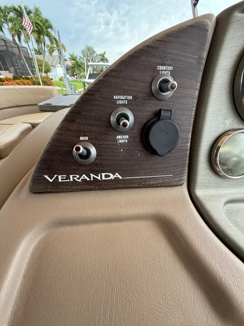 Slide: The Image of Close-up of a Veranda boat's control panel with switches for navigation and anchor lights. - 11