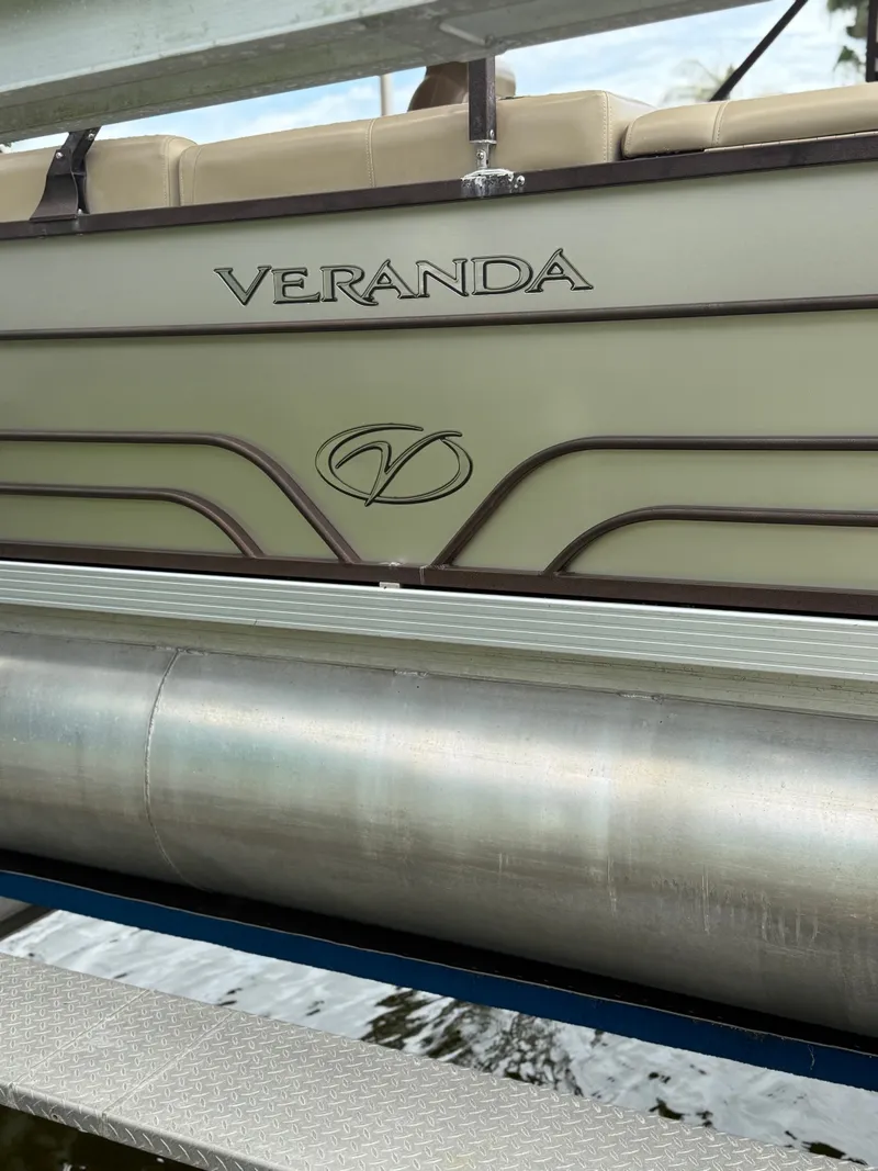 Slide: The Image of Close-up of a 2018 Veranda VVF25F2 pontoon boat with metal structure and logo. - 3