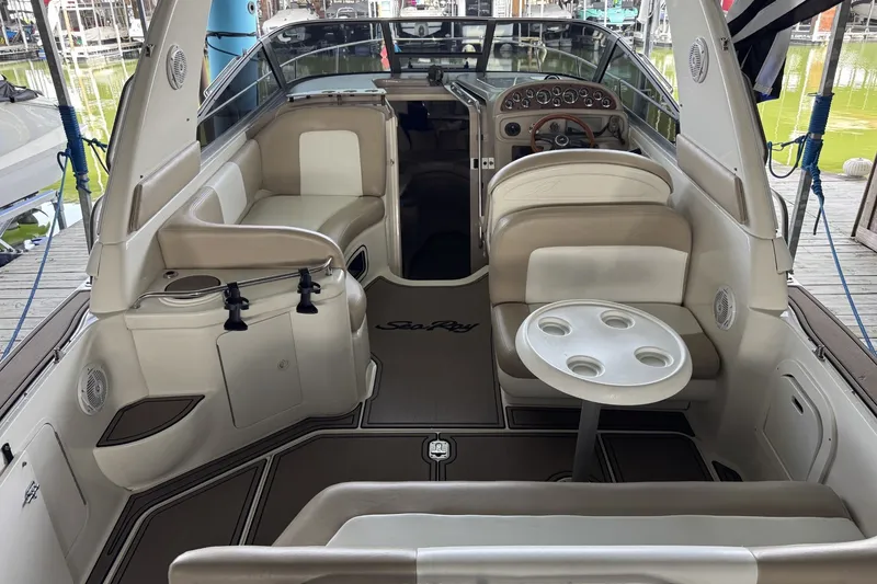 Slide: The Image of Interior of a 2000 Sea Ray 290 Sundancer boat with seating and table. - 4