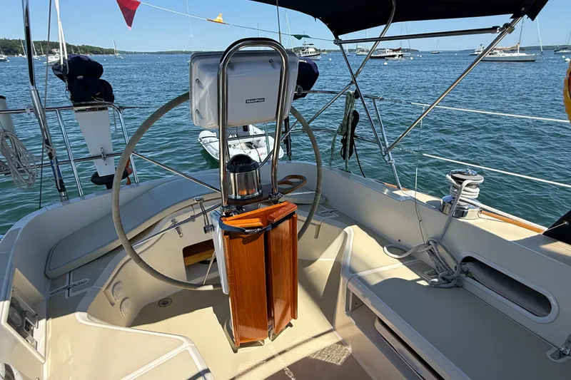 Slide: The Image of Cockpit of 2009 Sabre 386 sailboat with steering wheel and navigation equipment. - 76