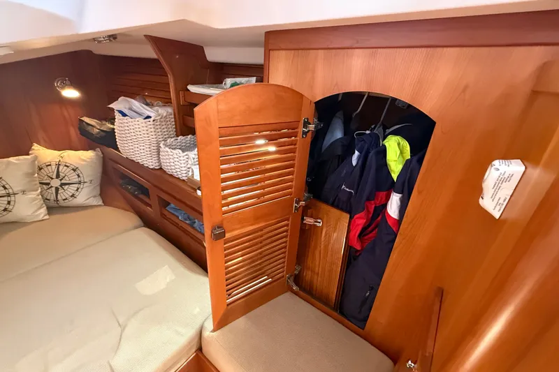 Slide: The Image of Cozy cabin interior of 2009 Sabre 386 yacht with wooden storage and nautical decor. - 62