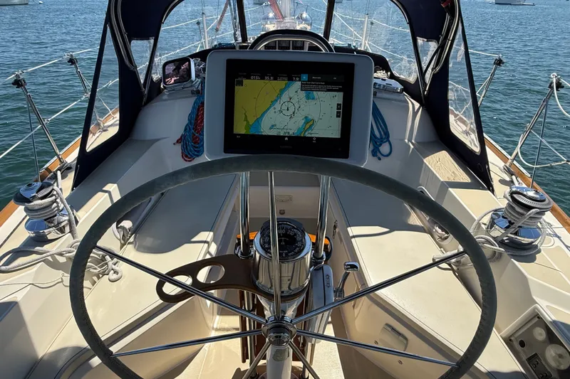 Slide: The Image of Cockpit of 2009 Sabre 386 sailboat with navigation display and steering wheel. - 79