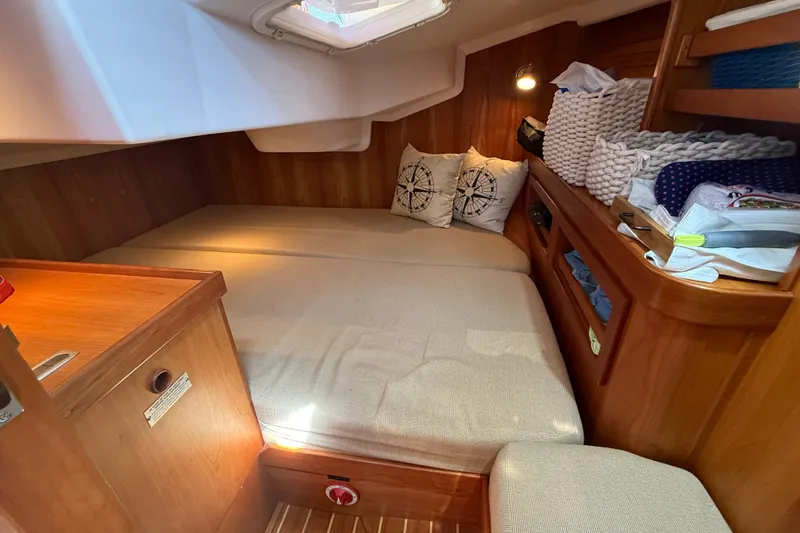 Slide: The Image of Cozy cabin interior of 2009 Sabre 386 sailboat with wooden finish and comfortable bedding. - 59
