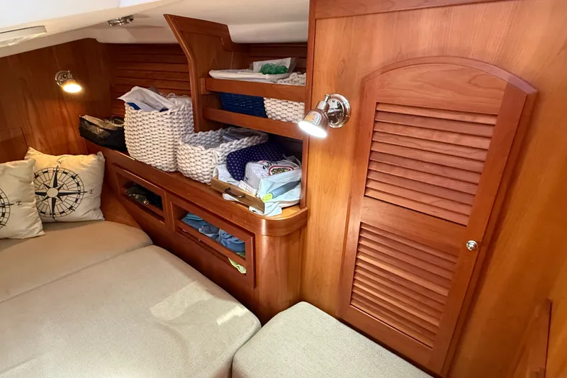Slide: The Image of Cozy cabin interior of 2009 Sabre 386 yacht with wooden storage and soft lighting. - 61