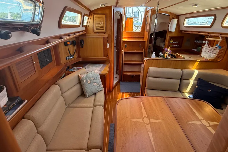 Slide: The Image of Interior of a 2009 Sabre 386 sailboat with elegant wood finish and cozy seating. - 14