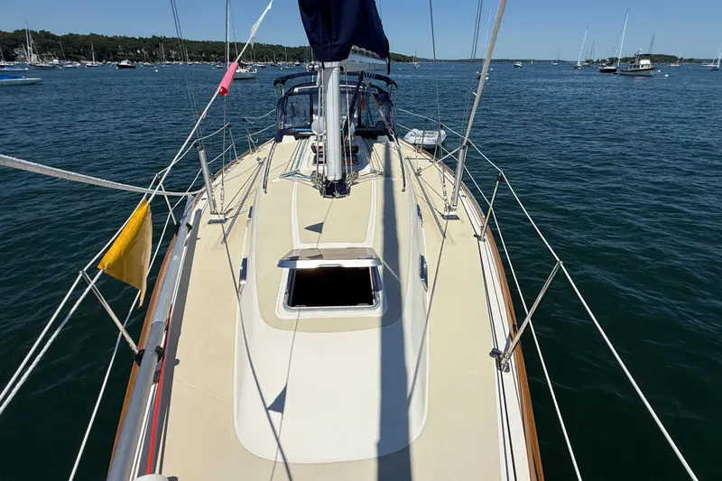Slide: The Image of 2009 Sabre 386 sailboat deck view on calm waters with surrounding boats. - 68