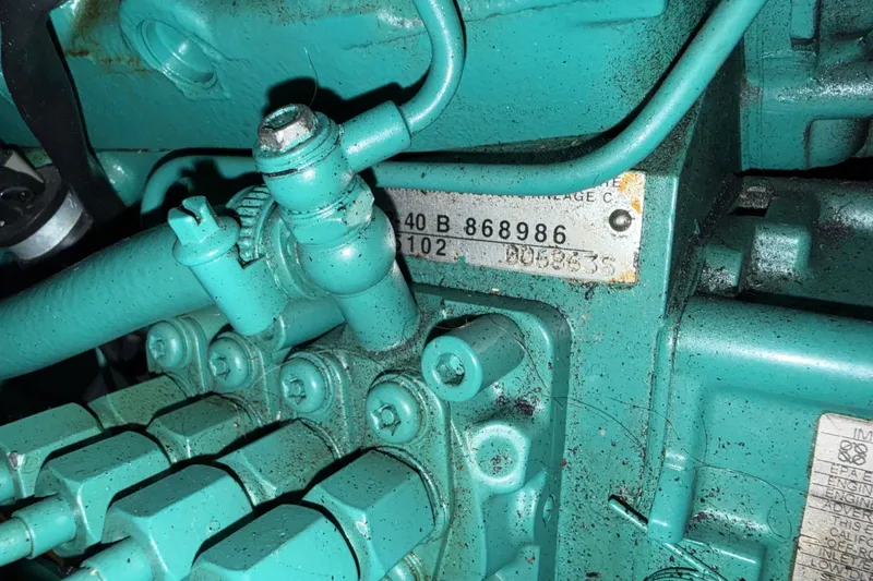 Slide: The Image of Close-up of a 2009 Sabre 386 engine component with visible serial numbers. - 97