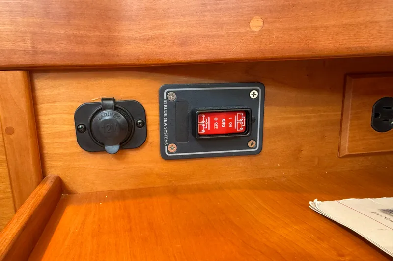 Slide: The Image of 12V marine socket and Blue Sea Systems switch on Sabre 386, 2009 model. - 20
