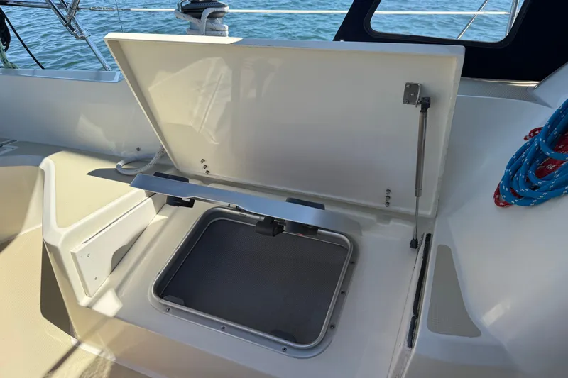 Slide: The Image of Open hatch on 2009 Sabre 386 sailboat deck, with ropes and ocean view. - 84